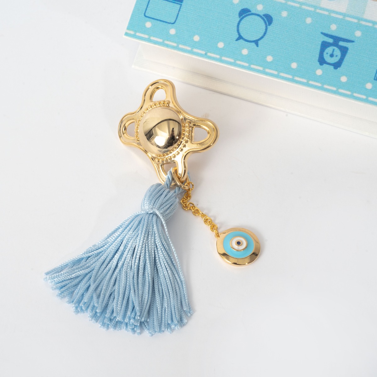 Παιδικό γούρι ορείχαλκος, κίτρινο επιχρύσωμα 24Κ, πιπίλα και μάτι από σμάλτο